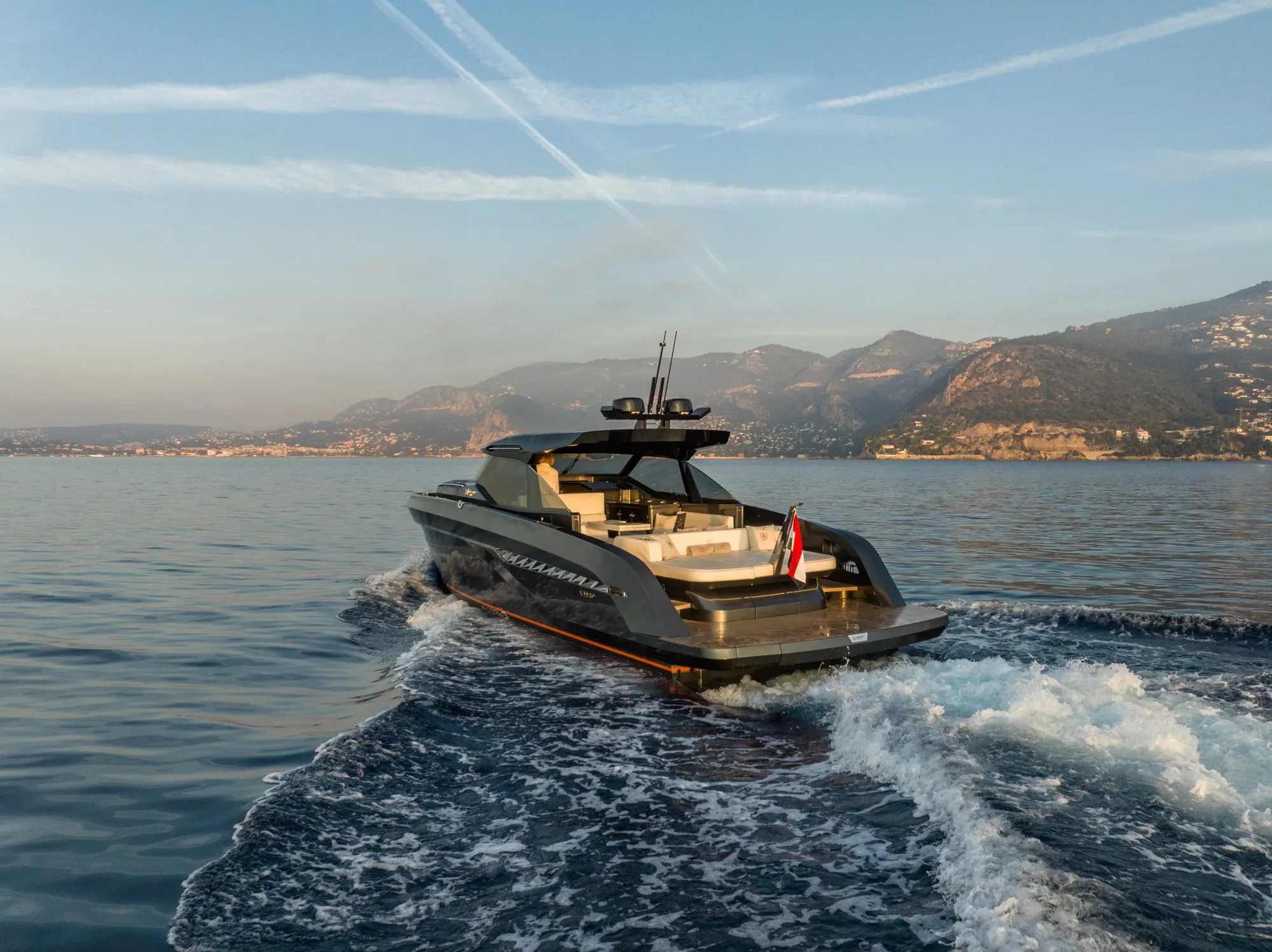 Black yacht cutting through the water