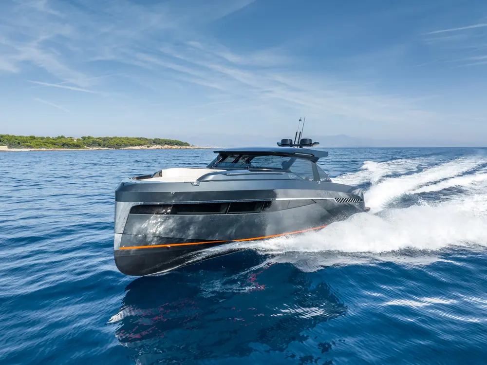 Motor yacht running at speed on open water