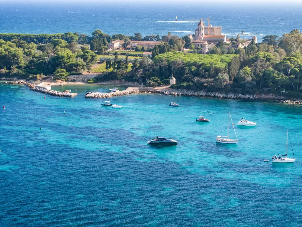 Aerial view of yachts anchored in a turquoise bay