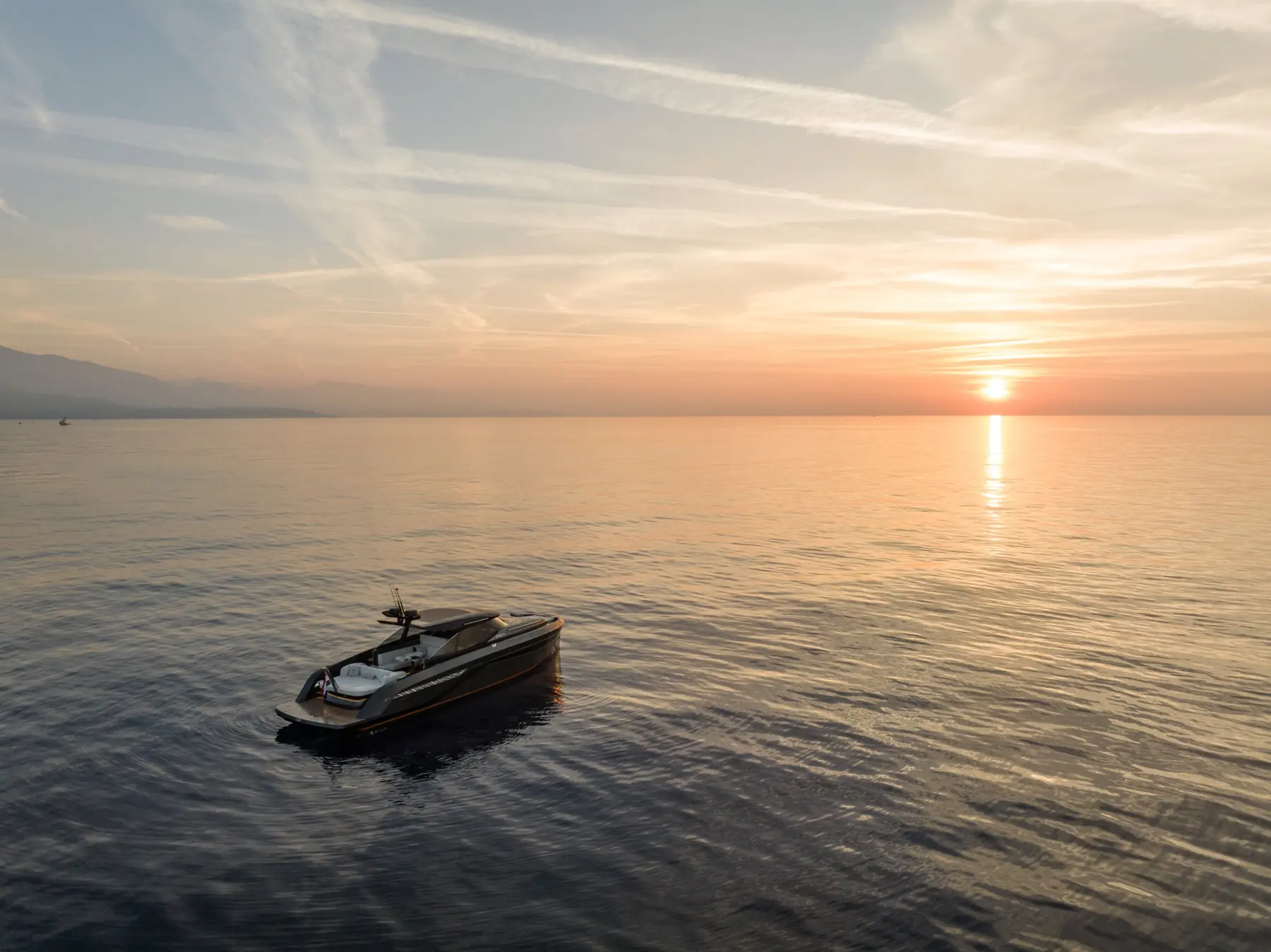 Yacht on calm water at sunset