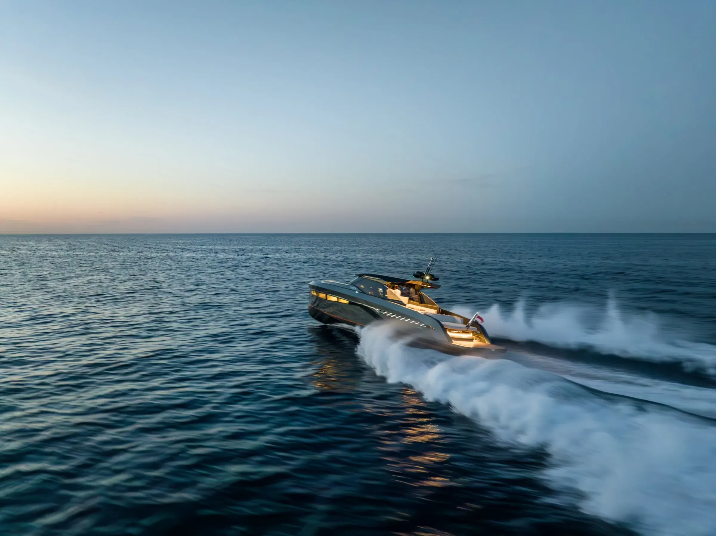 Yacht at speed at sunset