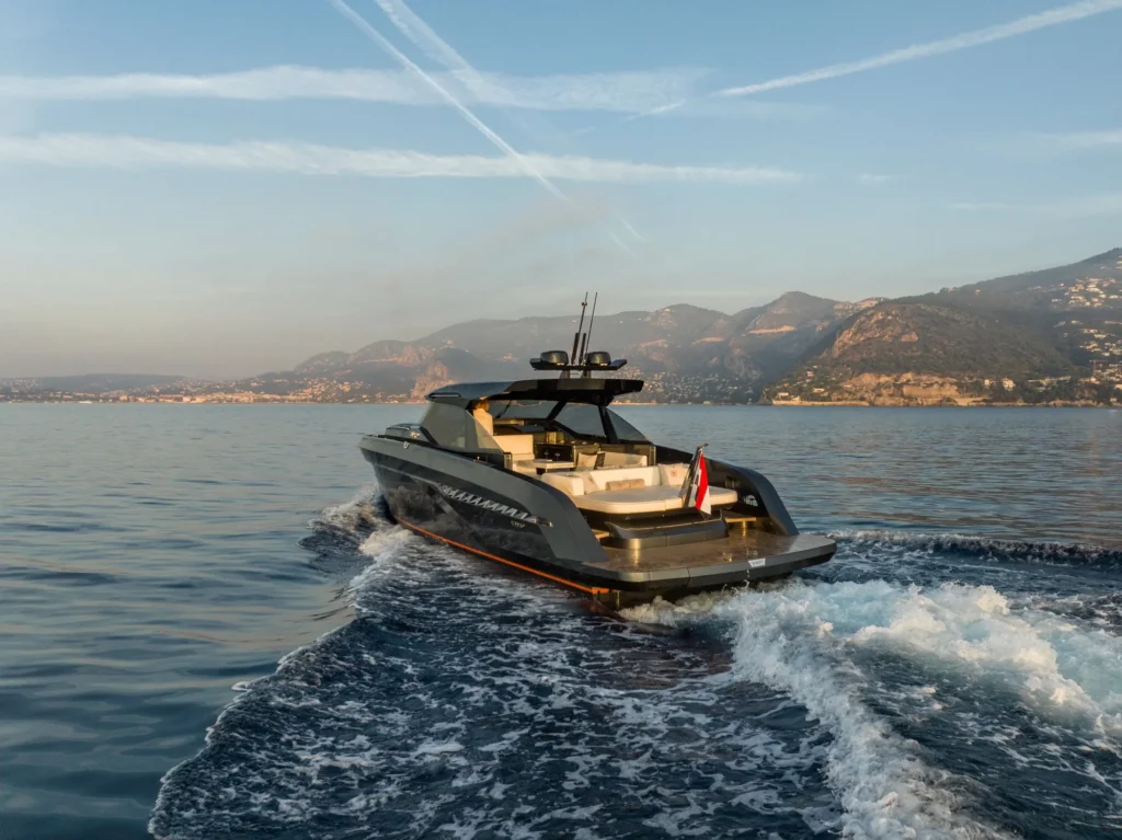 Black yacht cutting through the water