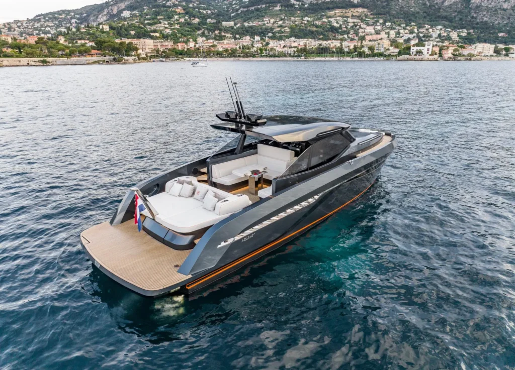 Motor yacht at speed near the coast